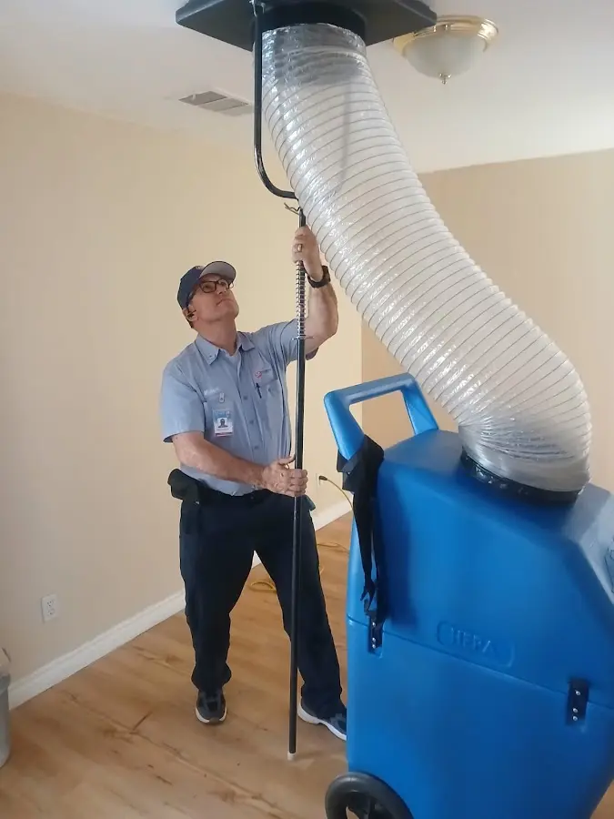 Furnace Tune-Up technician using HEPA equipment in Summerlin South